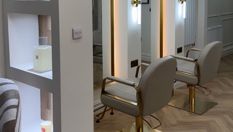 Luxurious salon chair at Nails by Emm Lou, Cheadle Hulme, England, GB, featuring modern decor and warm lighting.