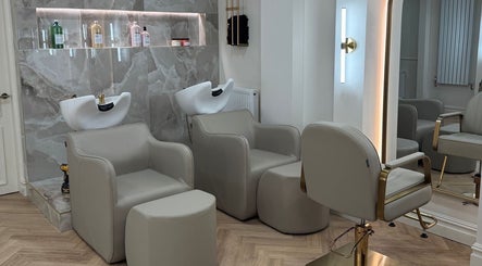 Elegant salon interior at Nails by Emm Lou, Cheadle Hulme, England, GB, featuring stylish chairs and wash sinks.