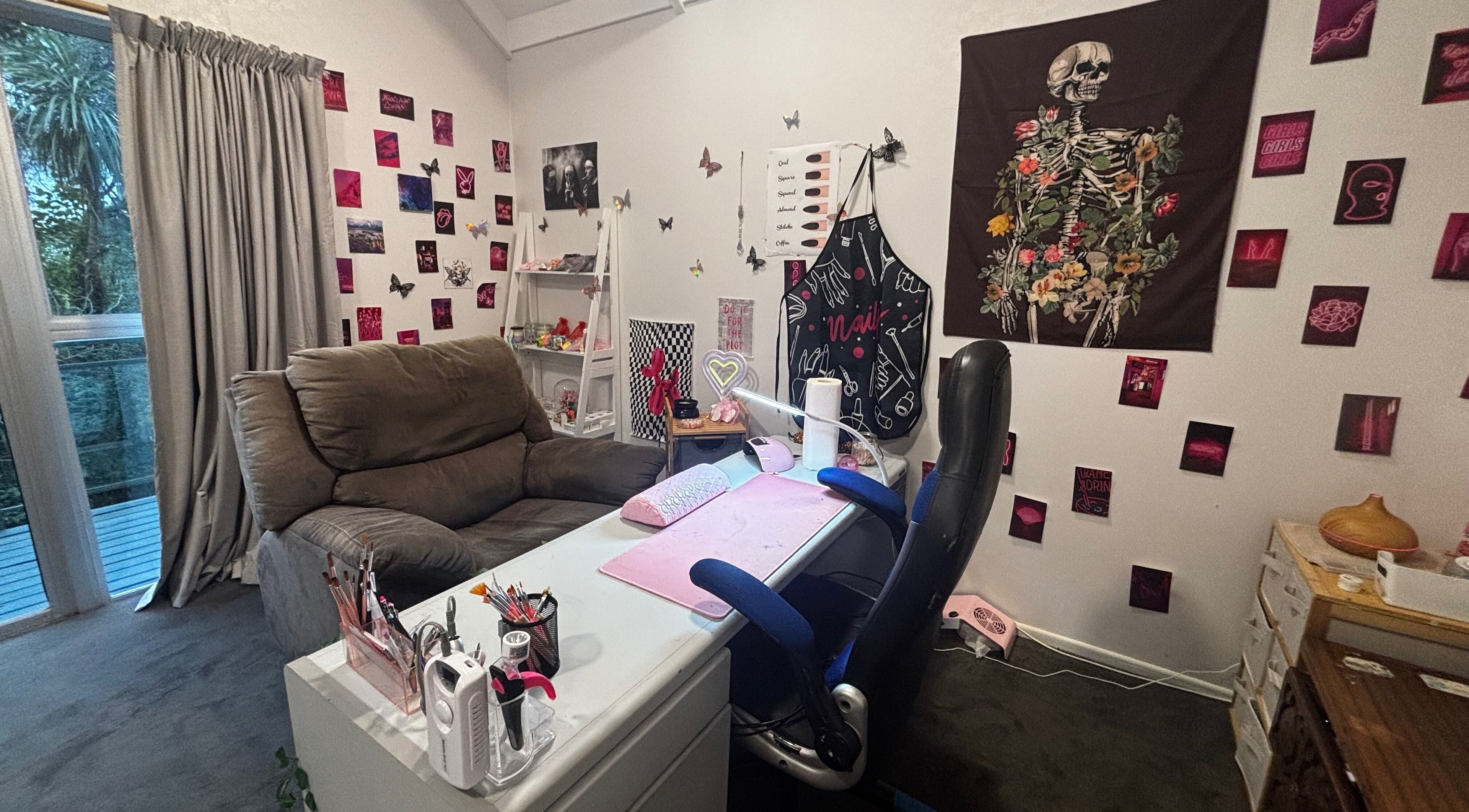 Chic nail studio at Executive Elegance, Dunedin, Otago, NZ with artistic decor and cozy seating.