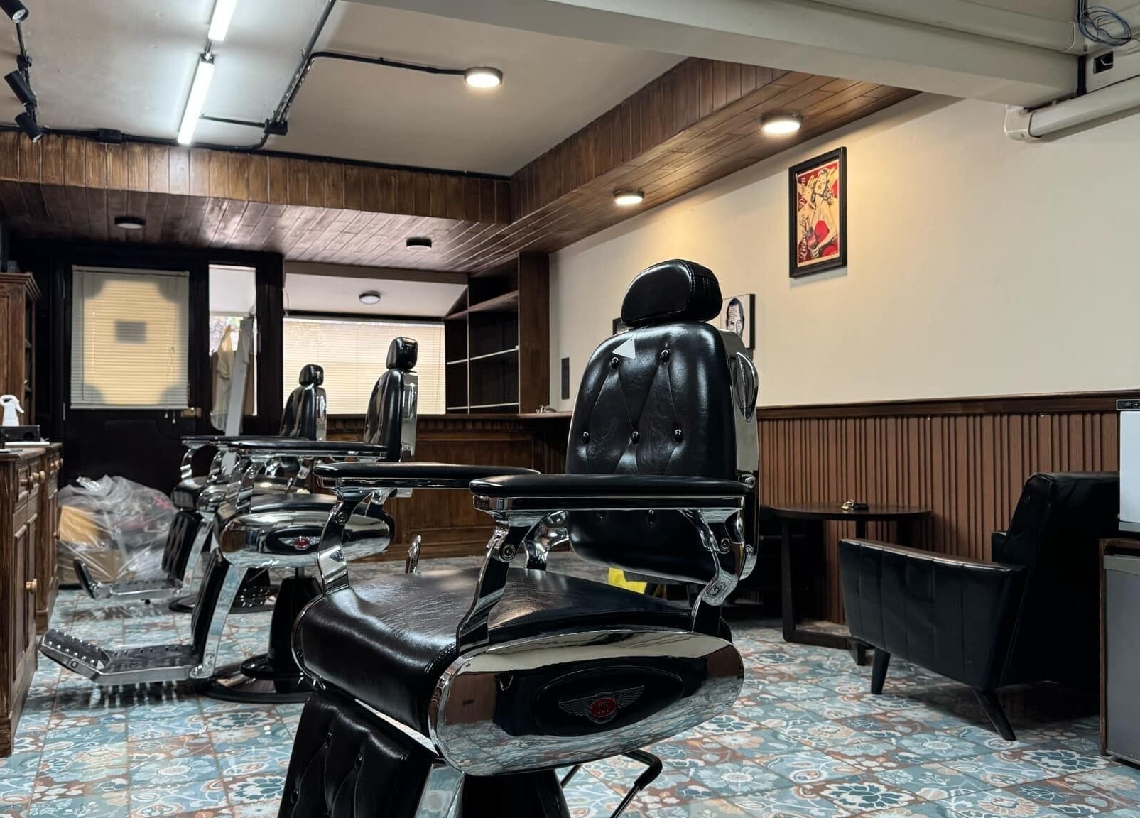 Interior of Liberty Grooming Lounge with leather chairs in Krung Thep Maha Nakhon, TH.