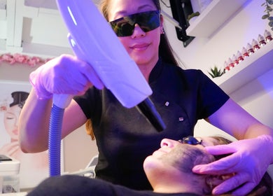 Laser treatment at Fine Line Studios, London, England, GB showcasing expert care.