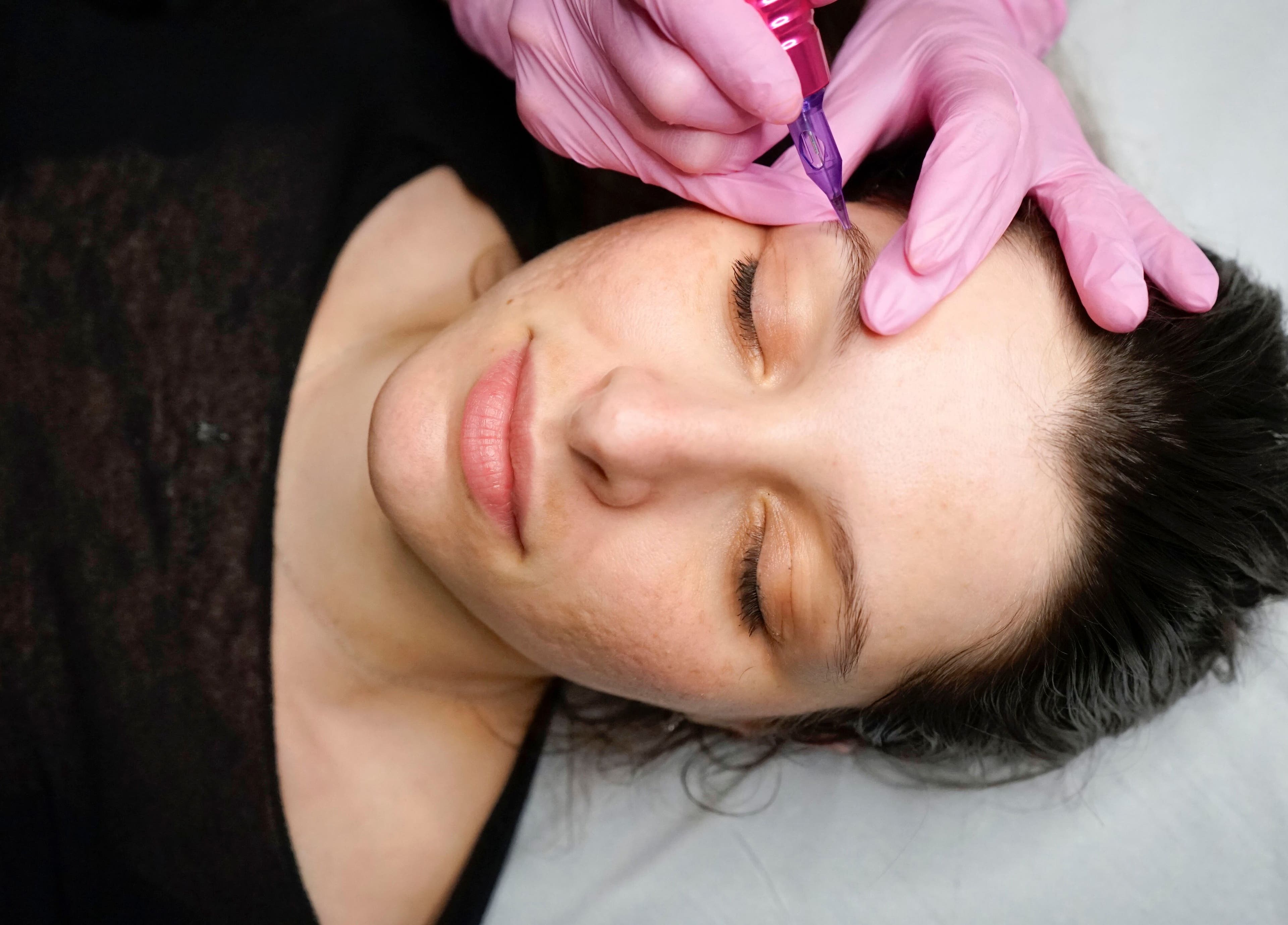 Eyebrow microblading service at Fine Line Studios, London, England, GB. Close-up of precise artistry.