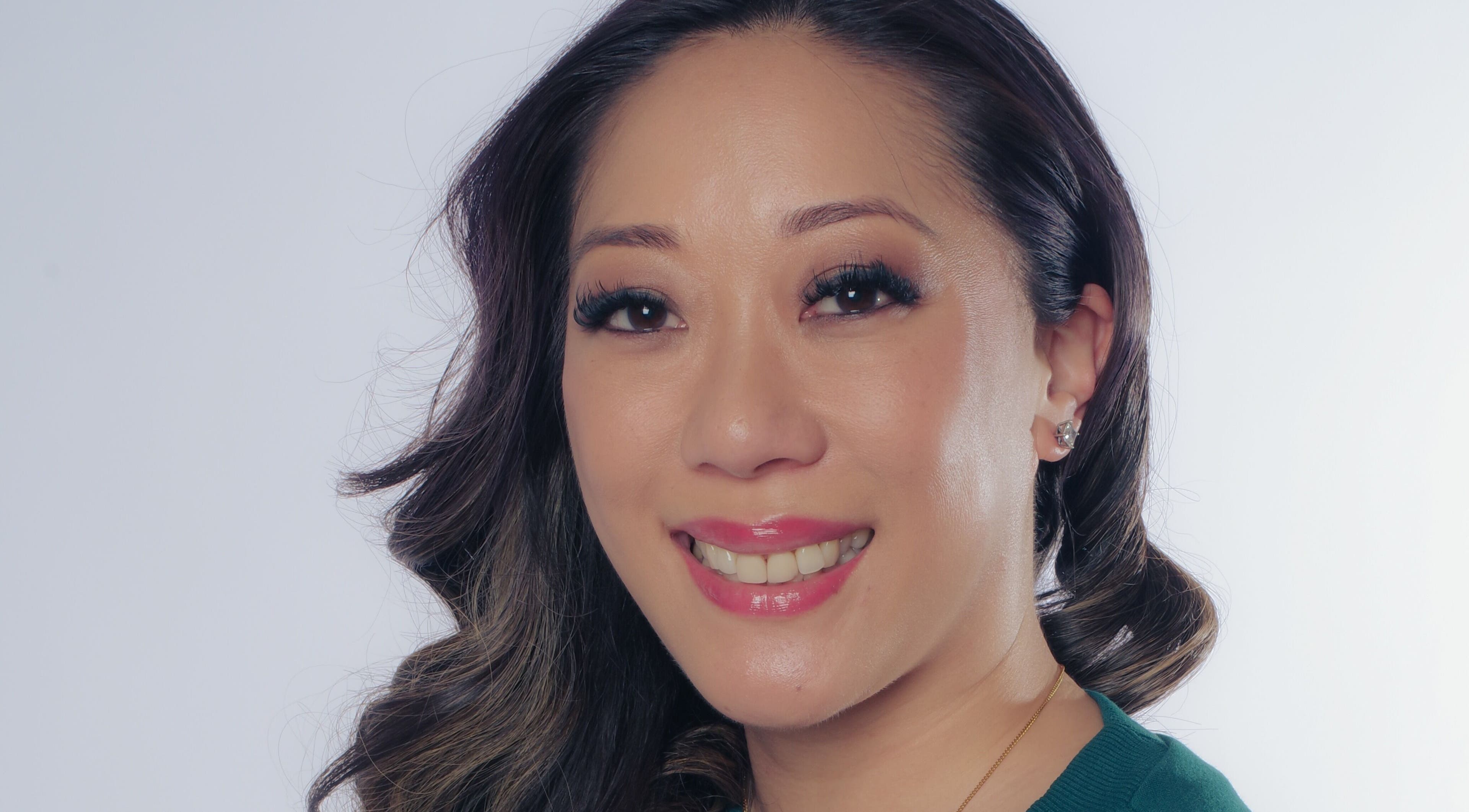 Client with radiant smile after beauty treatment at Fine Line Studios, London, England, GB.