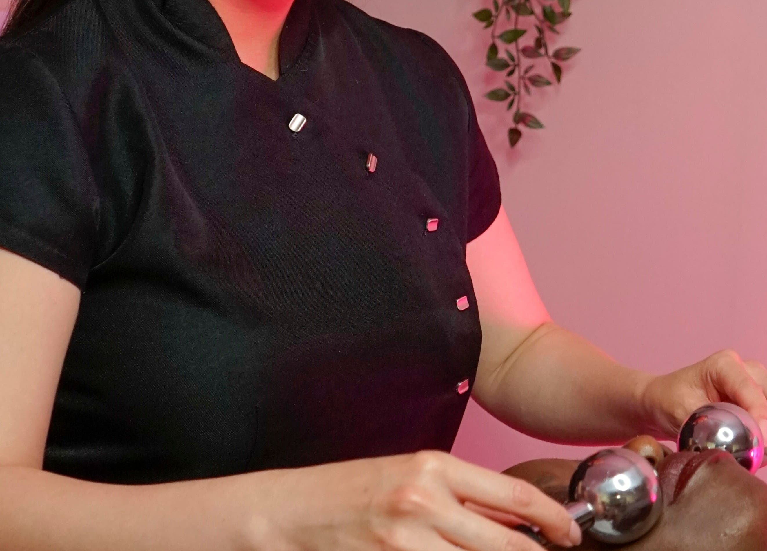 Therapist performing facial massage at Fine Line Studios, London, England, GB.