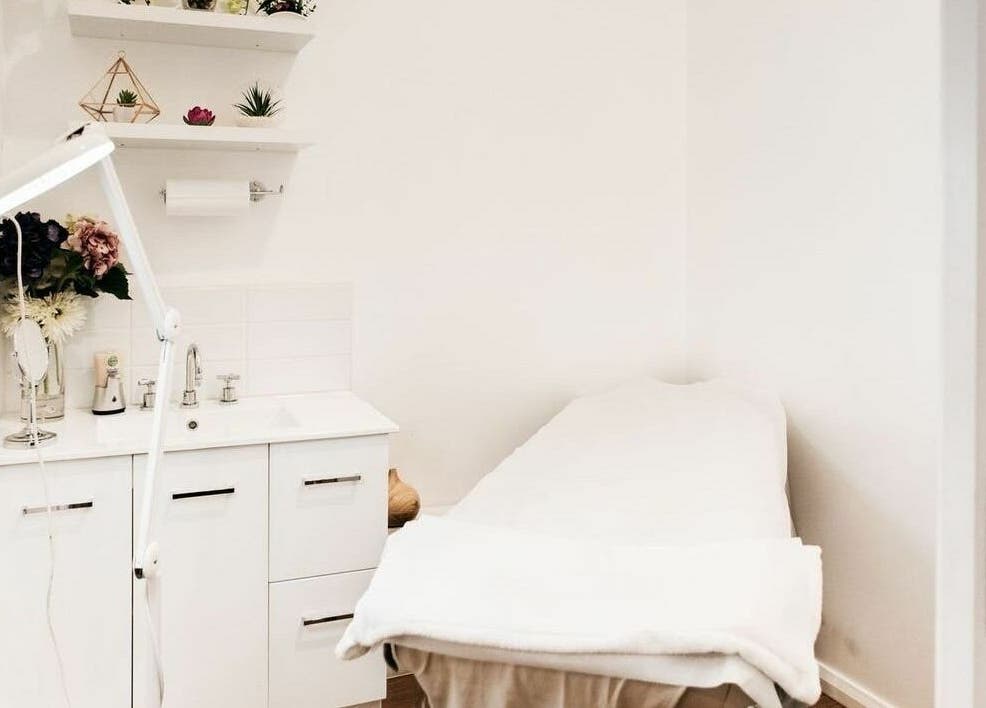 Relaxing treatment room at Beauty Brow and Lash Bar, Prahran, Victoria, AU with spa bed and elegant decor.