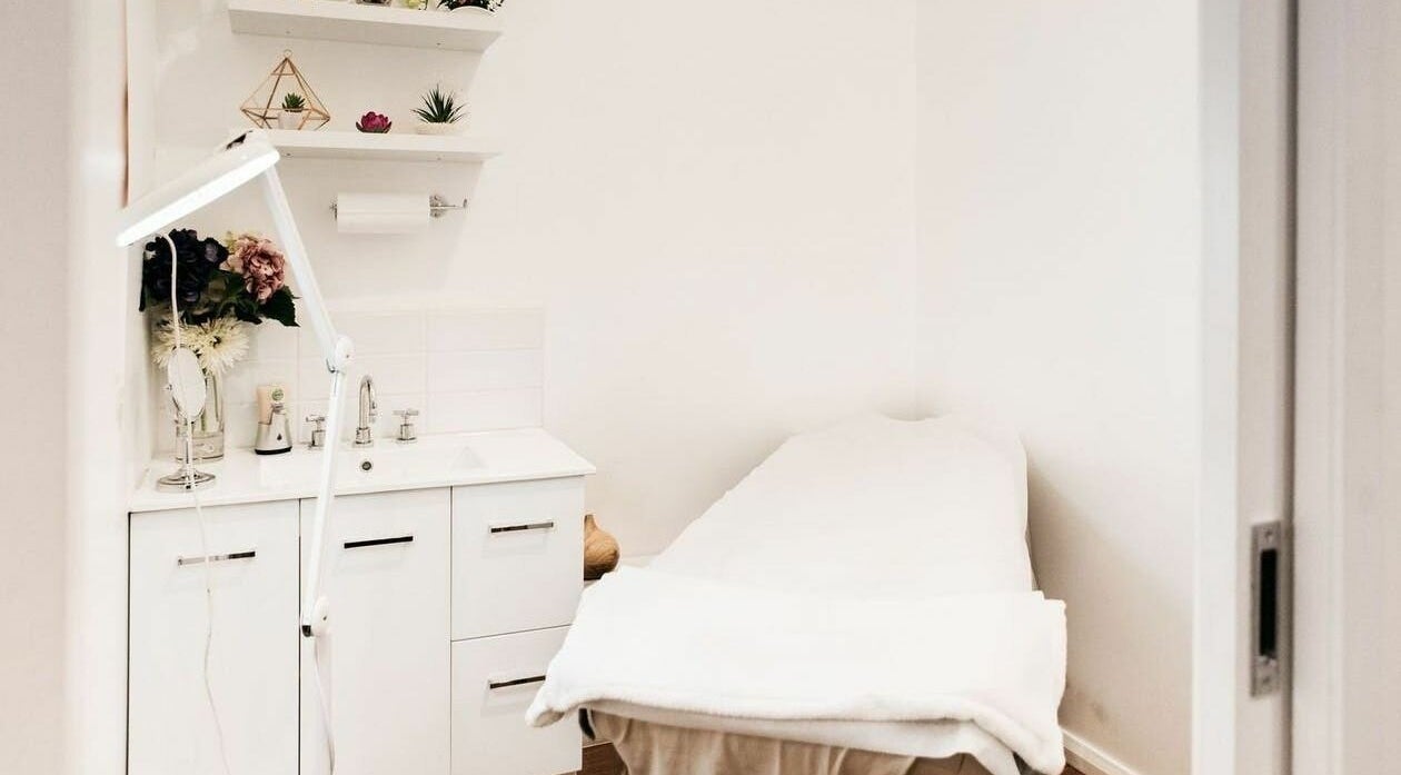Relaxing treatment room at Beauty Brow and Lash Bar, Prahran, Victoria, AU with spa bed and elegant decor.