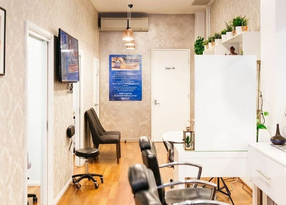 Chic interior of Beauty Brow and Lash Bar in Prahran, Victoria featuring stylish seating and modern decor.