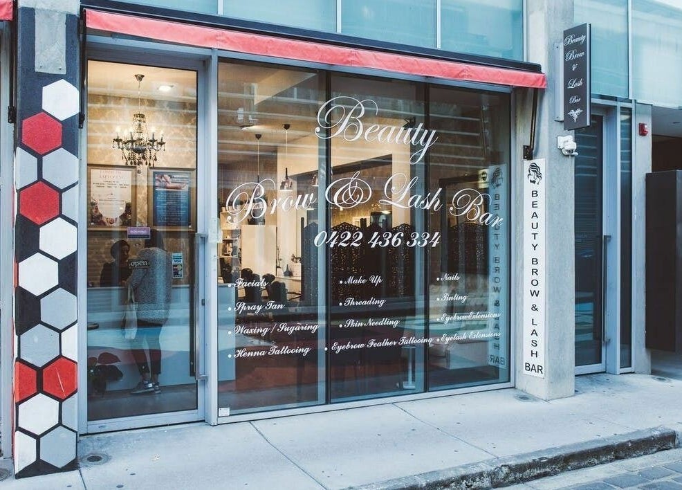 Entrance of Beauty Brow and Lash Bar in Prahran, Victoria, AU with stylish glass front and hexagon accents.