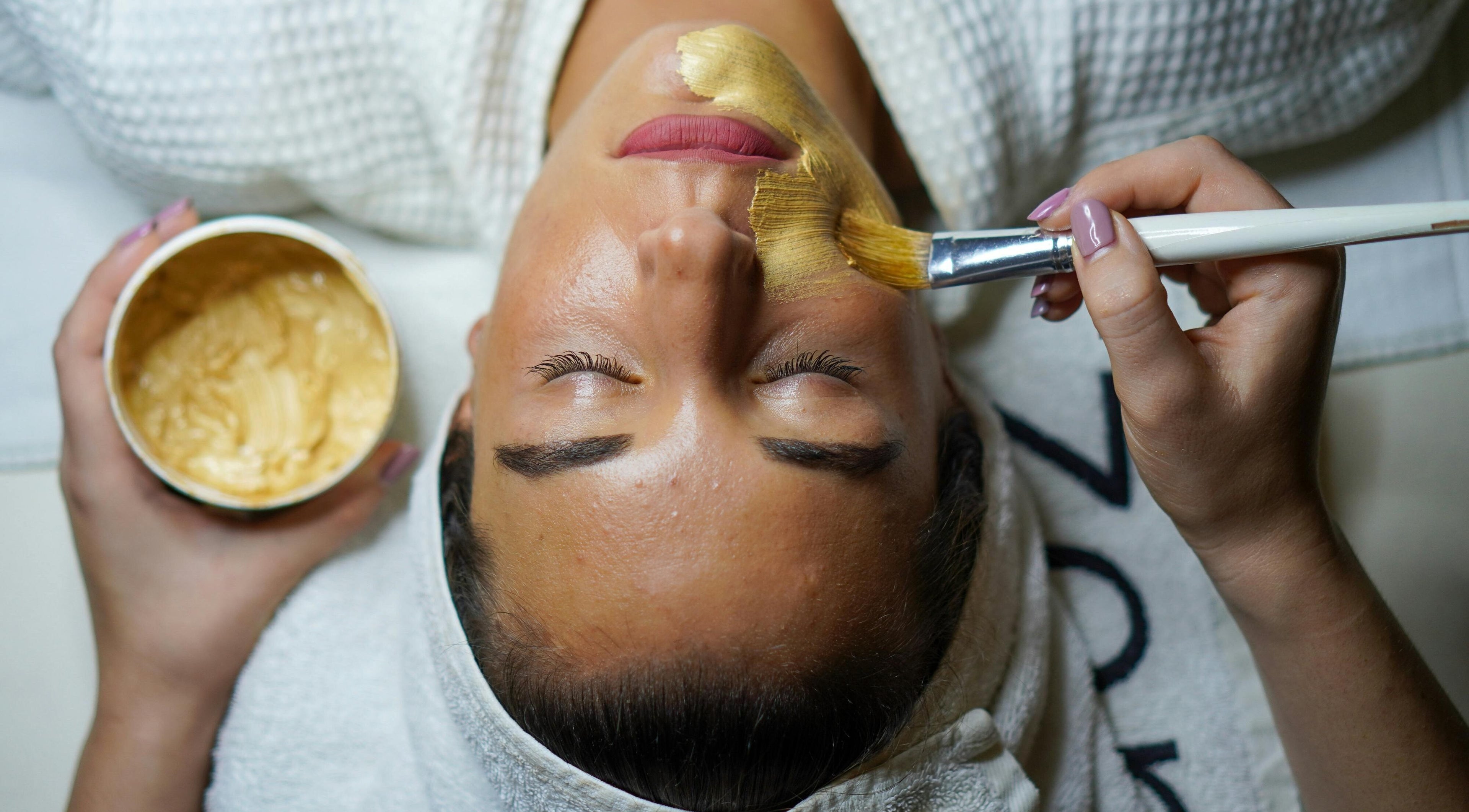 Revitalizing facial treatment at Sereno Spa, Livingston Manor, New York, US featuring a luxurious gold mask.