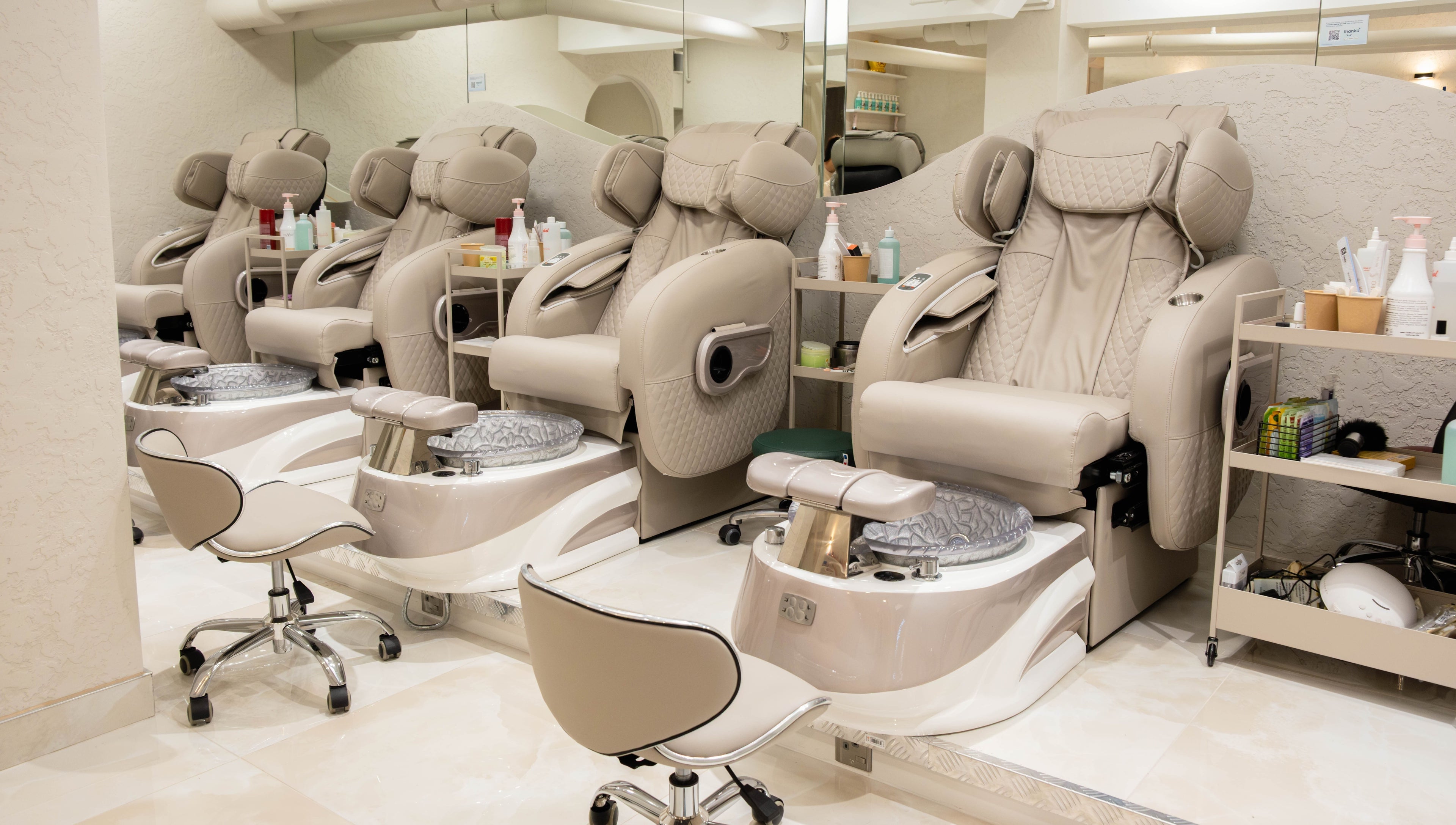 Luxurious pedicure chairs at Keo Spa, London, England, GB, offering a tranquil beauty experience.