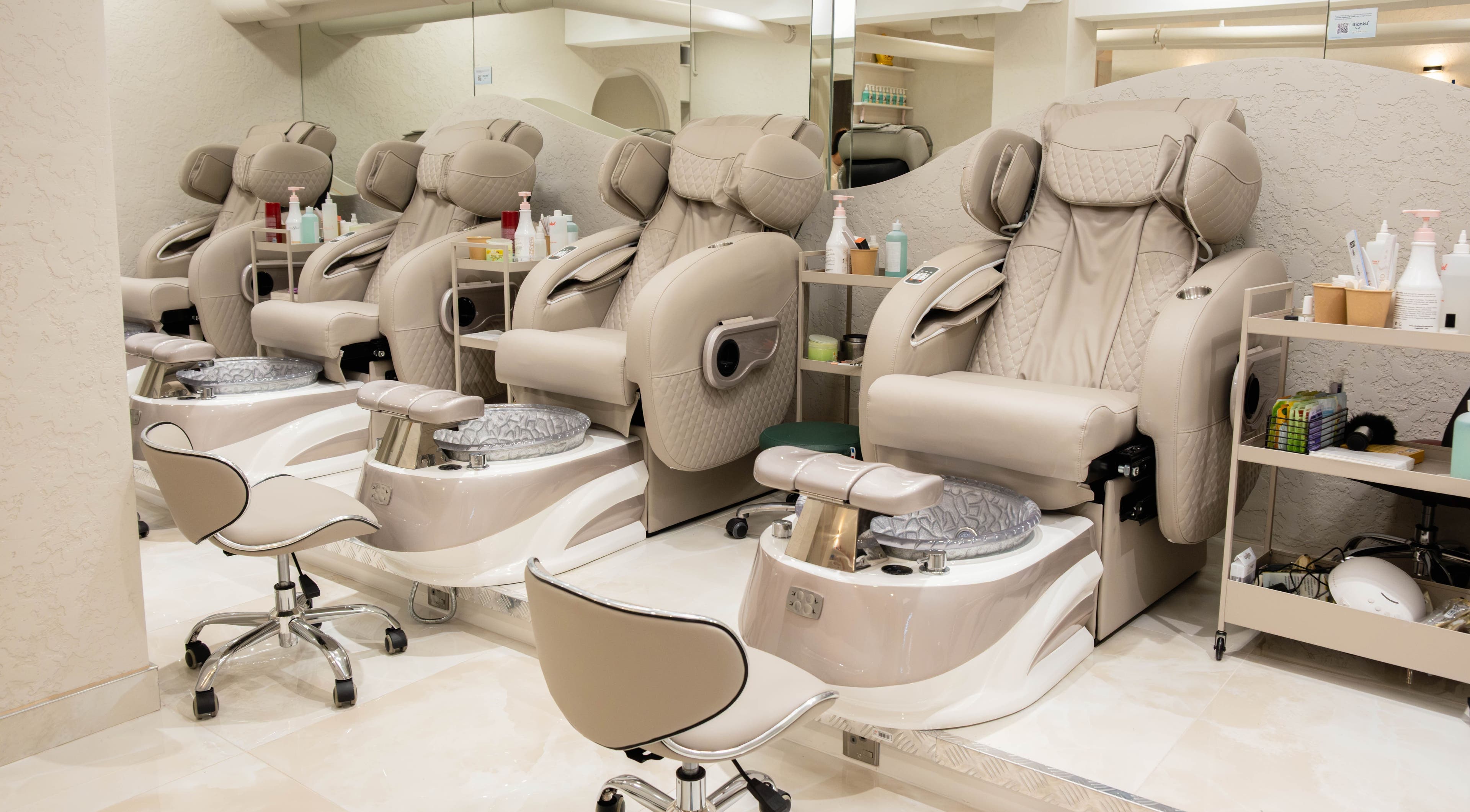 Luxurious pedicure chairs at Keo Spa, London, England, GB, offering a tranquil beauty experience.