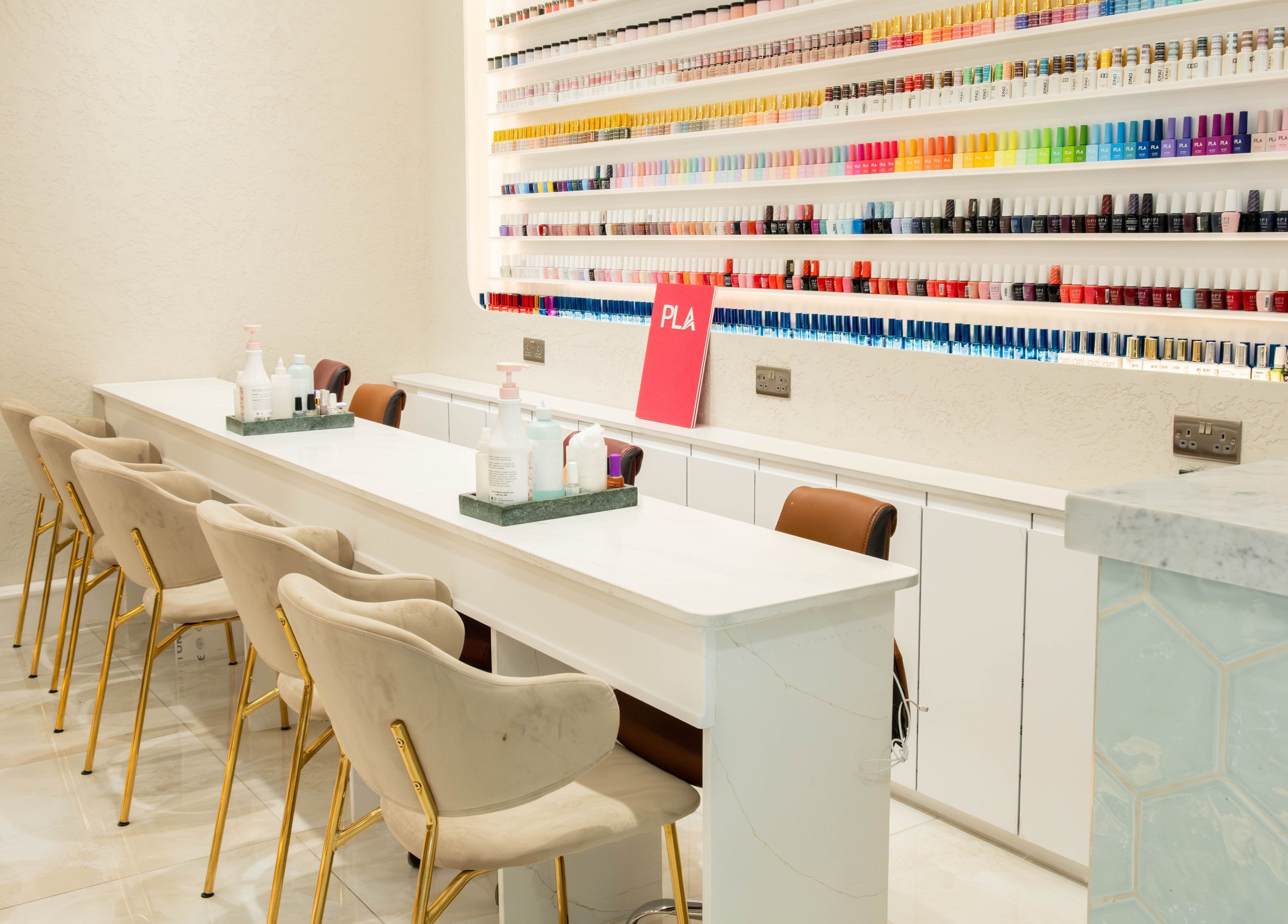 Elegant nail bar with vibrant polish options at Keo Spa, London, England, GB.