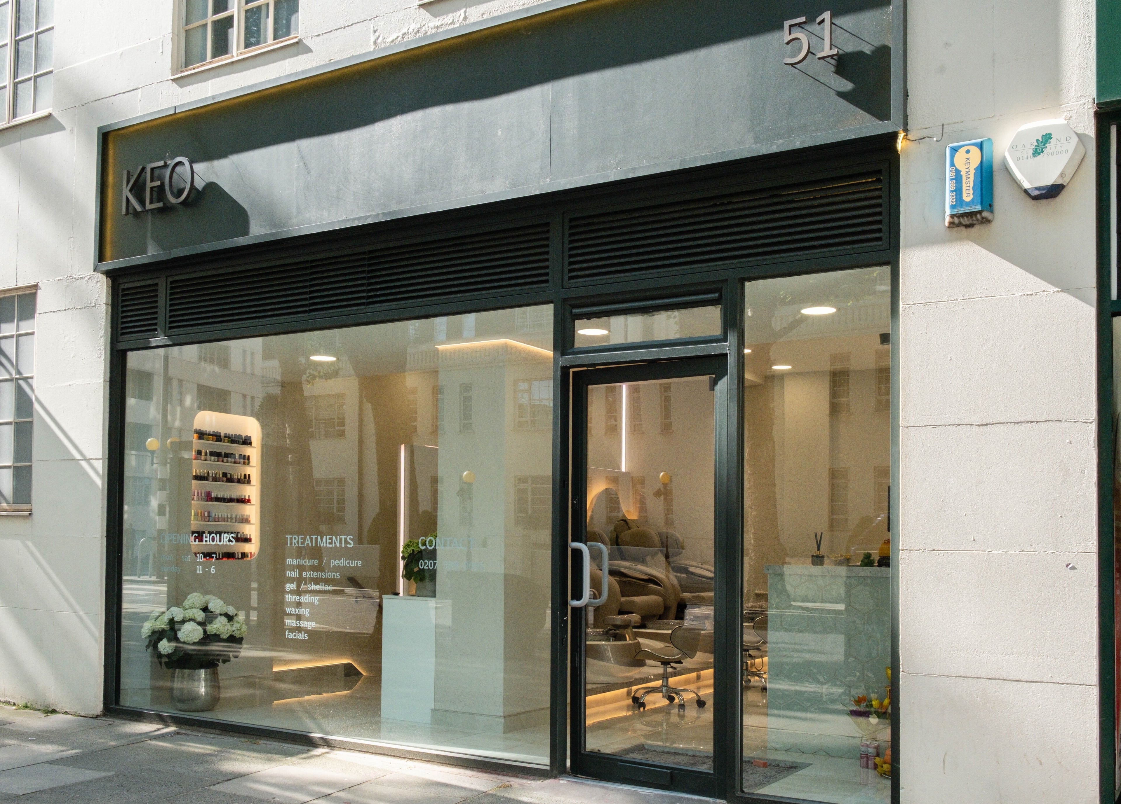 Exterior view of Keo Spa, London, England, GB, featuring stylish glass entry and modern signage.