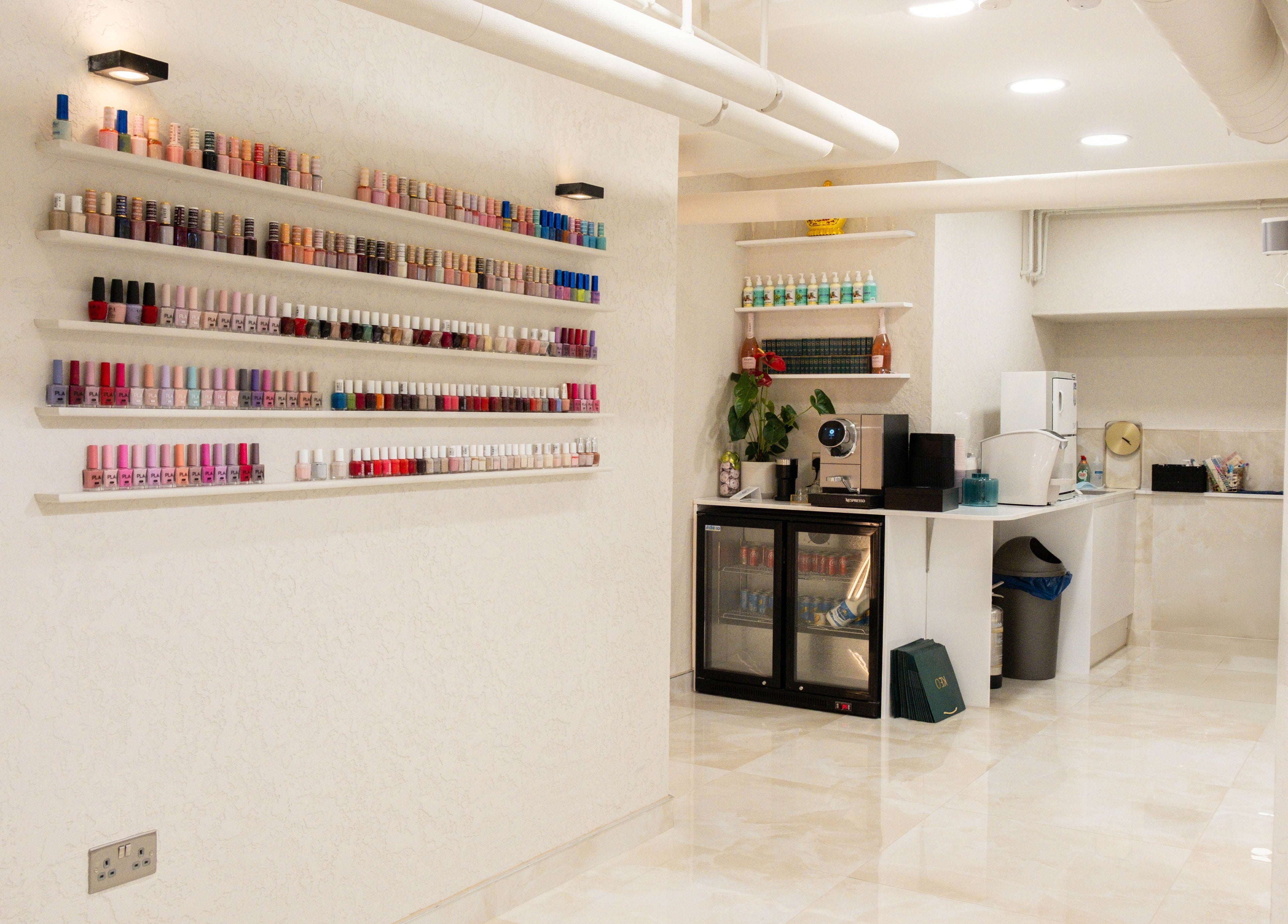 Chic nail polish display and refreshment area at Keo Spa, London, England, GB.