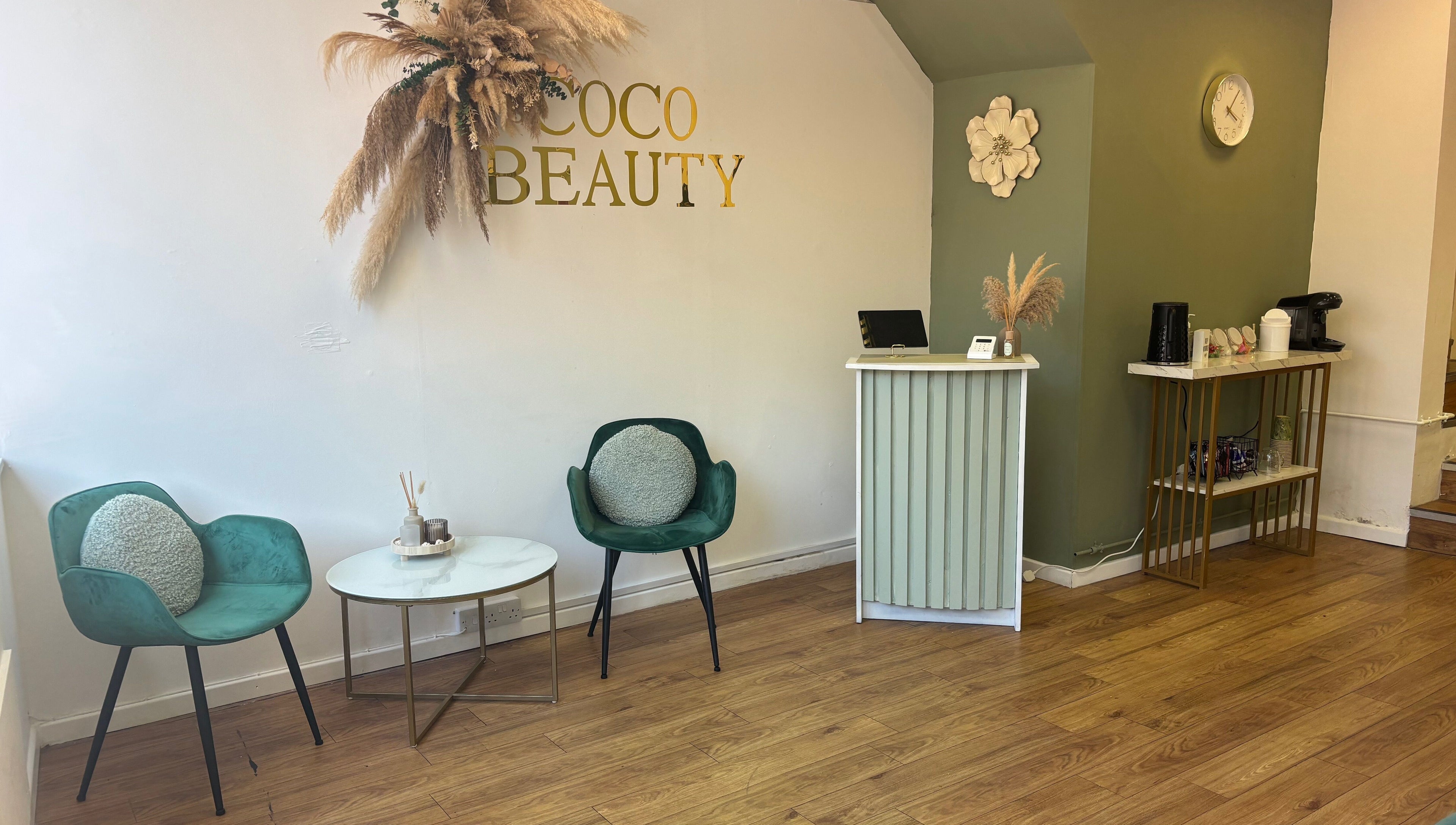 Welcoming reception area at Coco Beauty, Redruth, England, GB with elegant seating and decor.