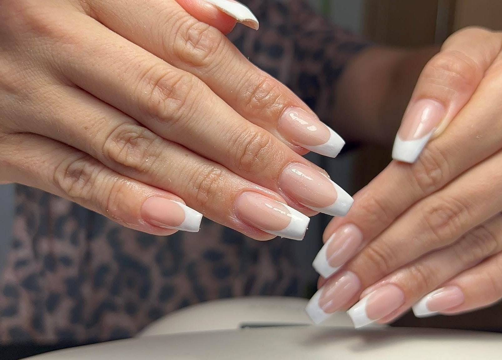 Stylish French manicure at Coco Beauty in Redruth, England, GB enhancing elegance and beauty.