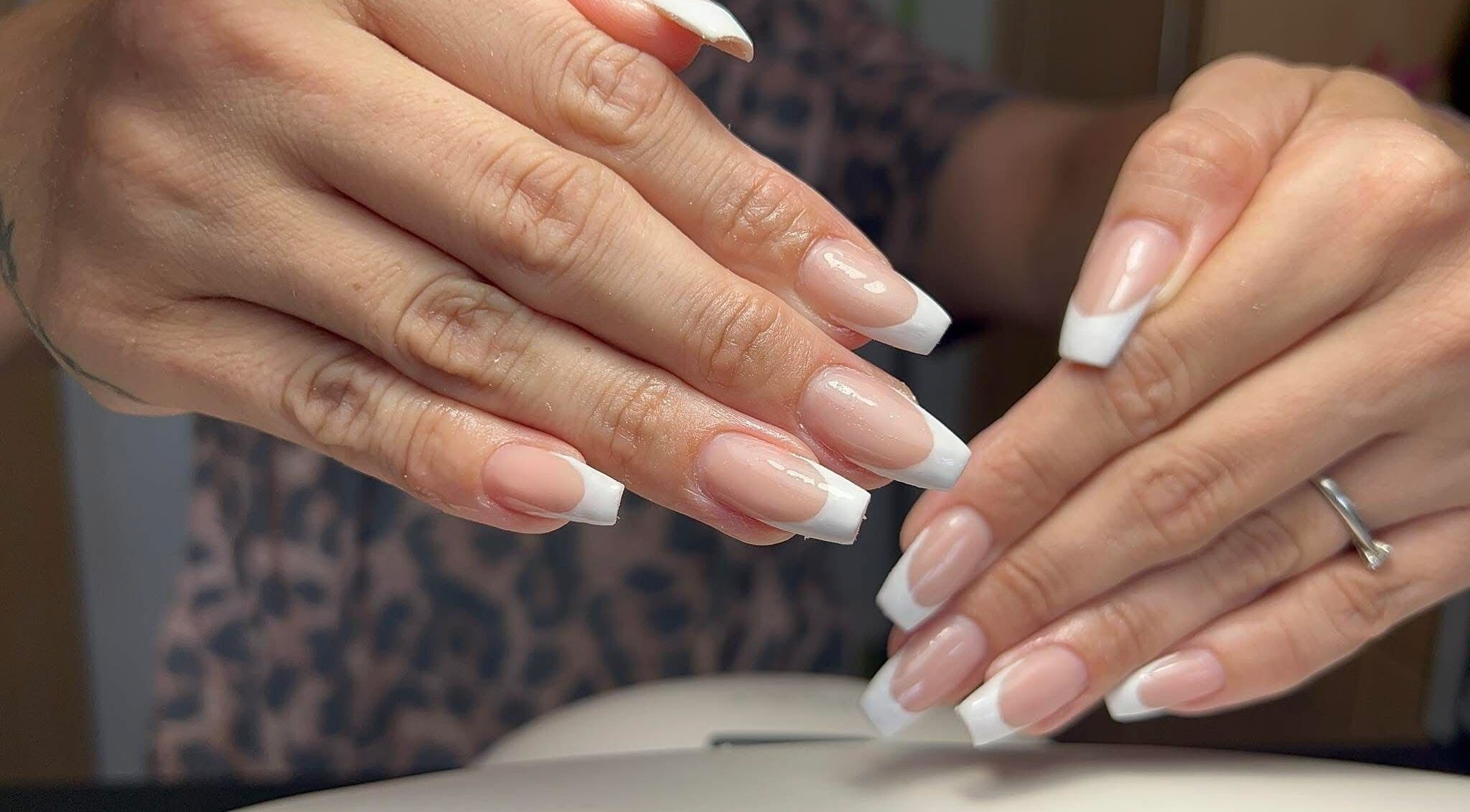 Stylish French manicure at Coco Beauty in Redruth, England, GB enhancing elegance and beauty.