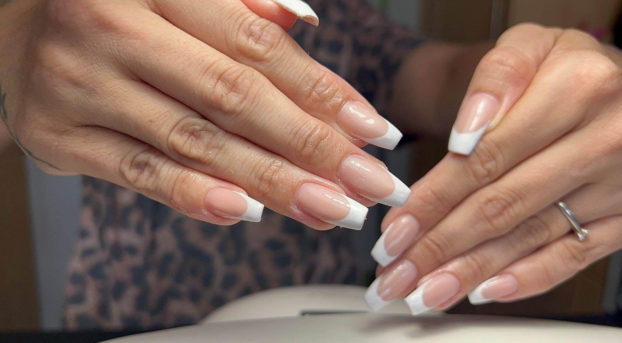 Stylish French manicure at Coco Beauty in Redruth, England, GB enhancing elegance and beauty.