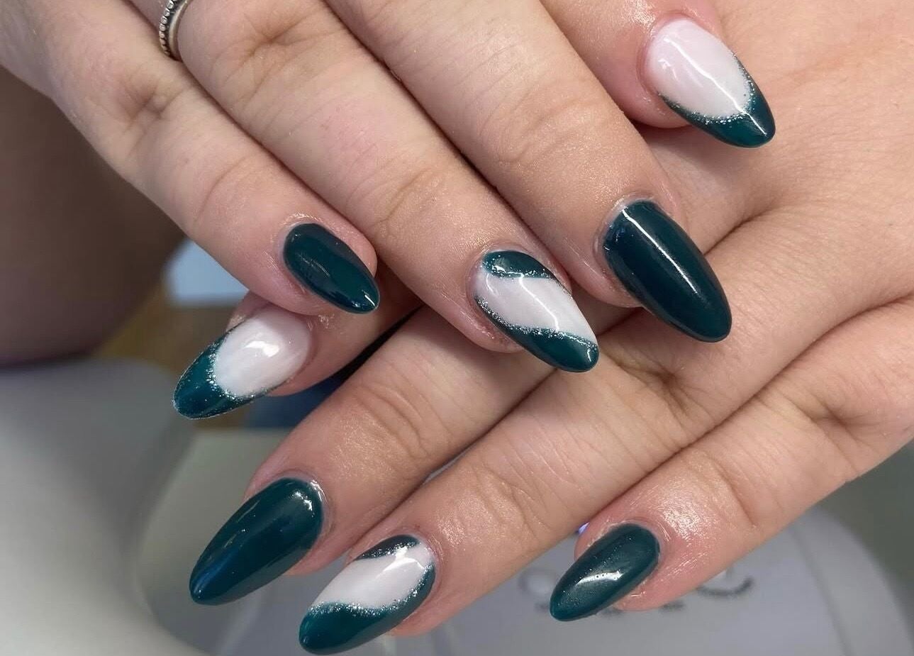 Stylish teal and white nail art at Coco Beauty, Redruth, England, GB. Perfect manicure design.