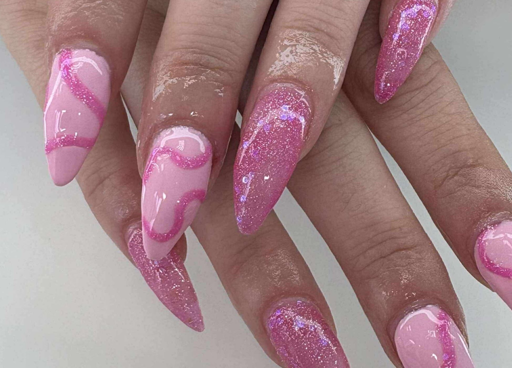 Elegant pink glitter nails design at Coco Beauty, Redruth, England, GB.