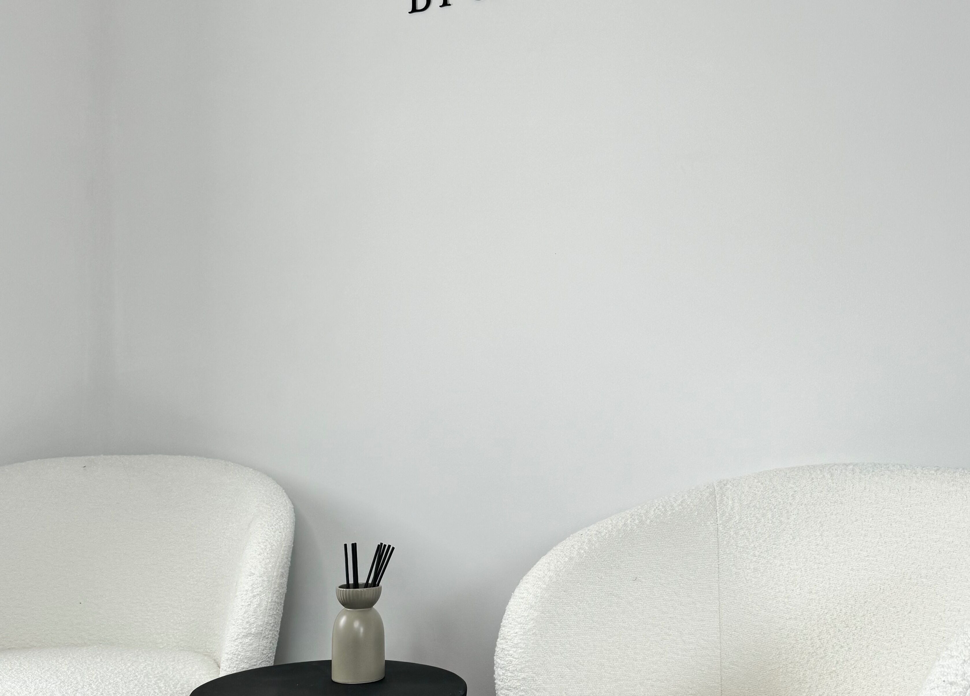 Cozy white chairs in the serene lounge at Lashes & Brows by Sarah, Southend-on-Sea, England, GB.