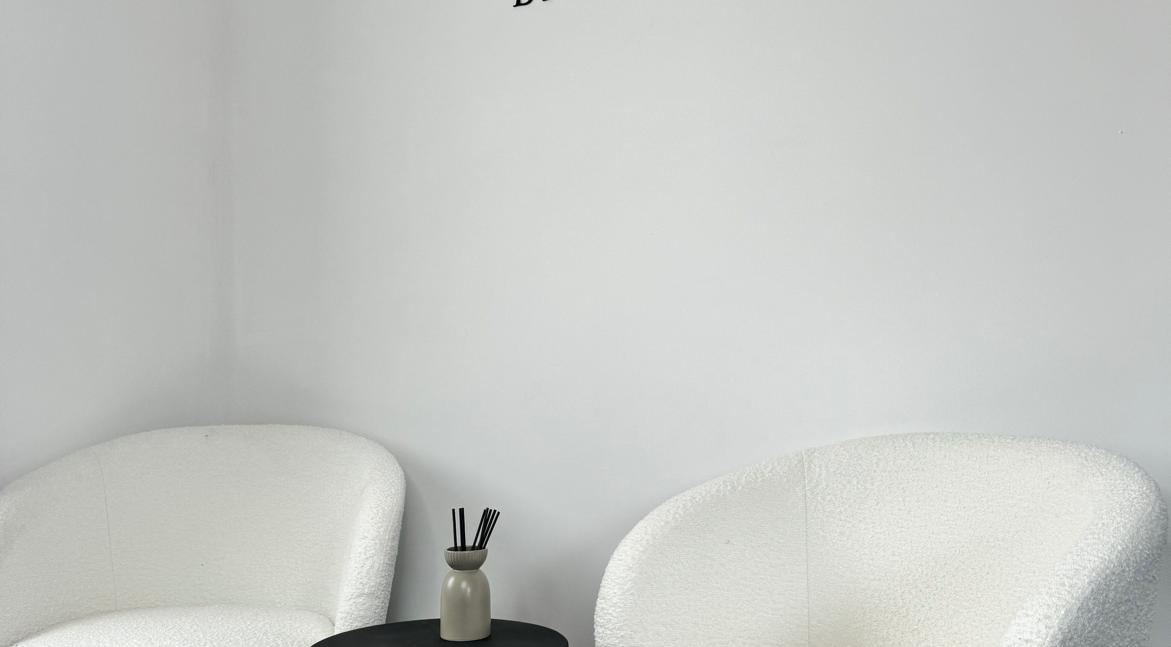 Cozy white chairs in the serene lounge at Lashes & Brows by Sarah, Southend-on-Sea, England, GB.