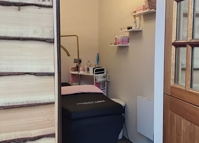 Cozy treatment room at Flutters Lash Studio, Washingborough, England, GB, with stylish interior and soft lighting.