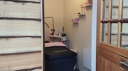 Cozy treatment room at Flutters Lash Studio, Washingborough, England, GB, with stylish interior and soft lighting.