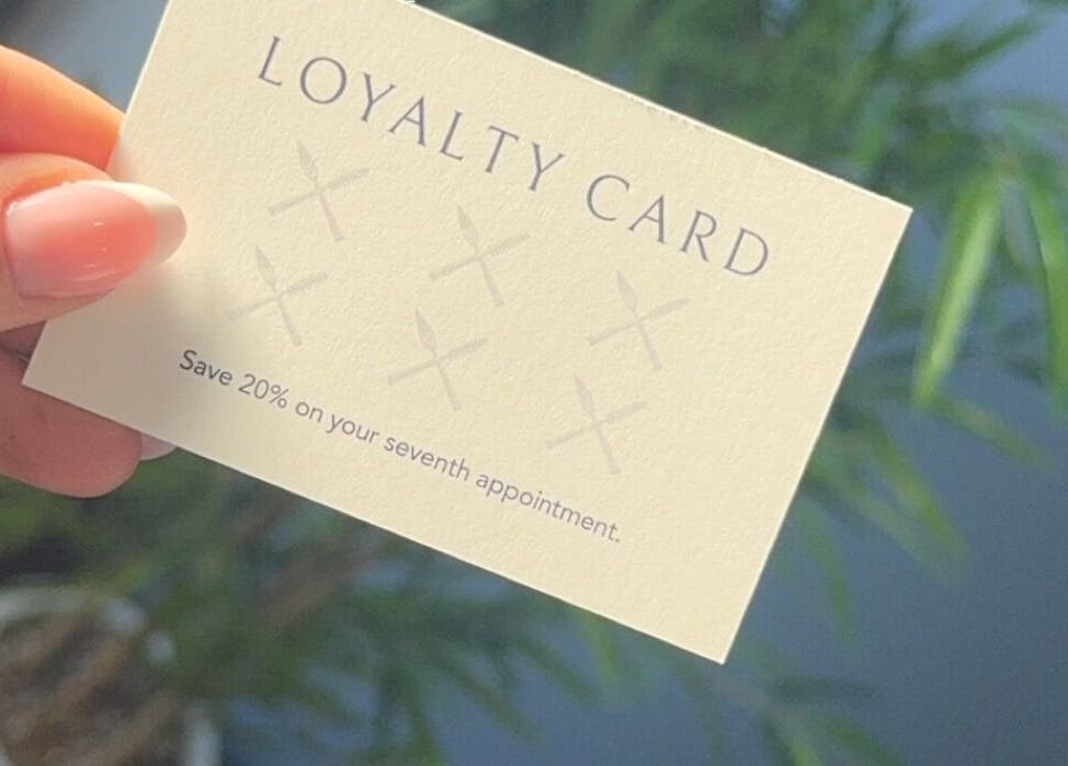Close-up of a loyalty card offering 20% off at Lavish Touch Dundee, Dundee, Scotland, GB.