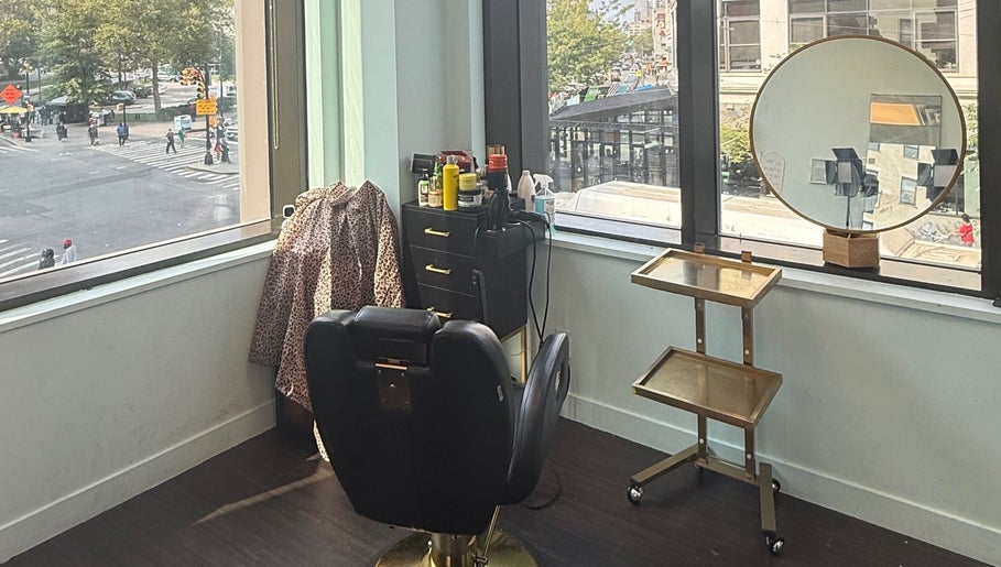Bright salon chair at Silky | The Healthy Hair Experts, New York, New York, US with city view.
