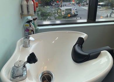 Hair washing station at Silky | The Healthy Hair Experts, New York, New York, US, with city view.