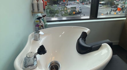 Hair washing station at Silky | The Healthy Hair Experts, New York, New York, US, with city view.