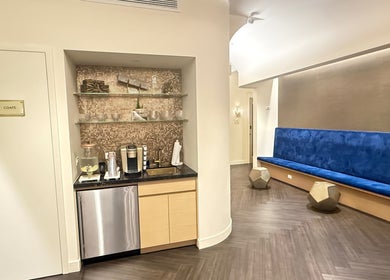 Relaxing lounge area at Silky | The Healthy Hair Experts in New York, New York, US with seating and refreshments.
