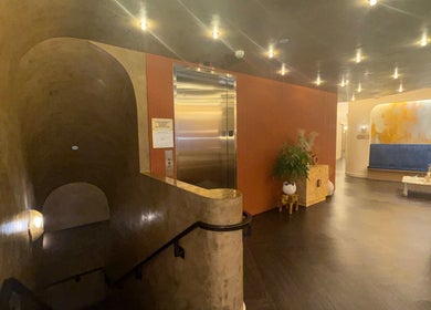 Entrance lobby of Silky | The Healthy Hair Experts in New York, New York, US, featuring warm lighting and modern decor.