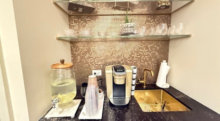 Refreshment corner at Silky | The Healthy Hair Experts, New York, New York, US, with drinks and coffee machine.