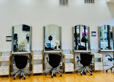 Chic salon interior of Silky | The Healthy Hair Experts 3 in New York, New York, US, showcasing stylish workstations.