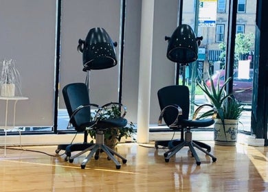 Stylish salon seating at Silky | The Healthy Hair Experts 3 in New York, New York, US, featuring modern decor.