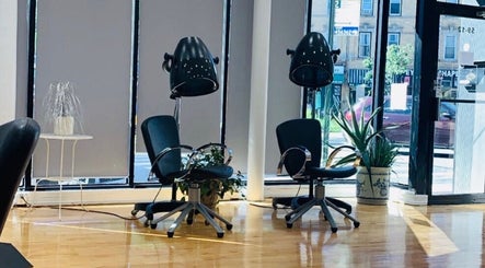 Stylish salon seating at Silky | The Healthy Hair Experts 3 in New York, New York, US, featuring modern decor.