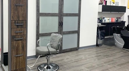 Modern salon interior at Silky | The Healthy Hair Experts, New York, New York, US. Sleek styling chairs and equipment.