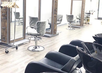 Chic salon setup at Silky | The Healthy Hair Experts, New York, New York, US with modern styling chairs.