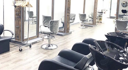 Chic salon setup at Silky | The Healthy Hair Experts, New York, New York, US with modern styling chairs.