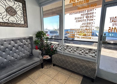 Elegant waiting area at NV Thai Spa in Las Vegas, Nevada, US, featuring plush seating and decor.