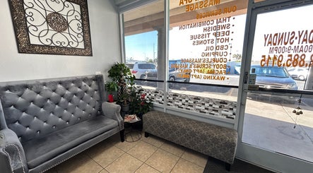 Elegant waiting area at NV Thai Spa in Las Vegas, Nevada, US, featuring plush seating and decor.