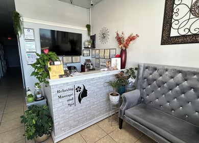 Cozy reception area at NV Thai Spa in Las Vegas, Nevada, US with elegant decor and plush seating.