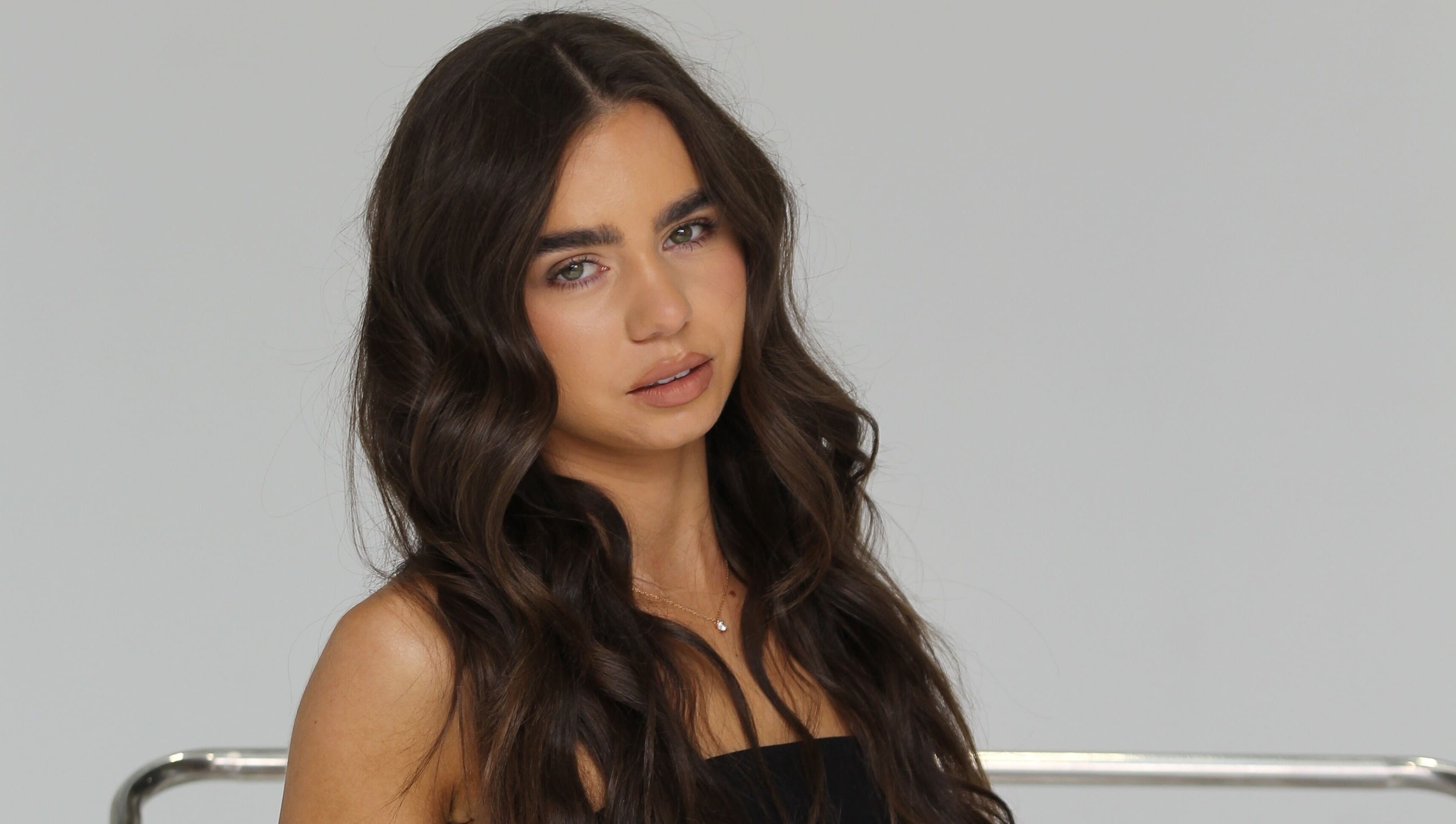 Radiant brunette with wavy hair at Glow Your Way, Two Wells, South Australia, AU.