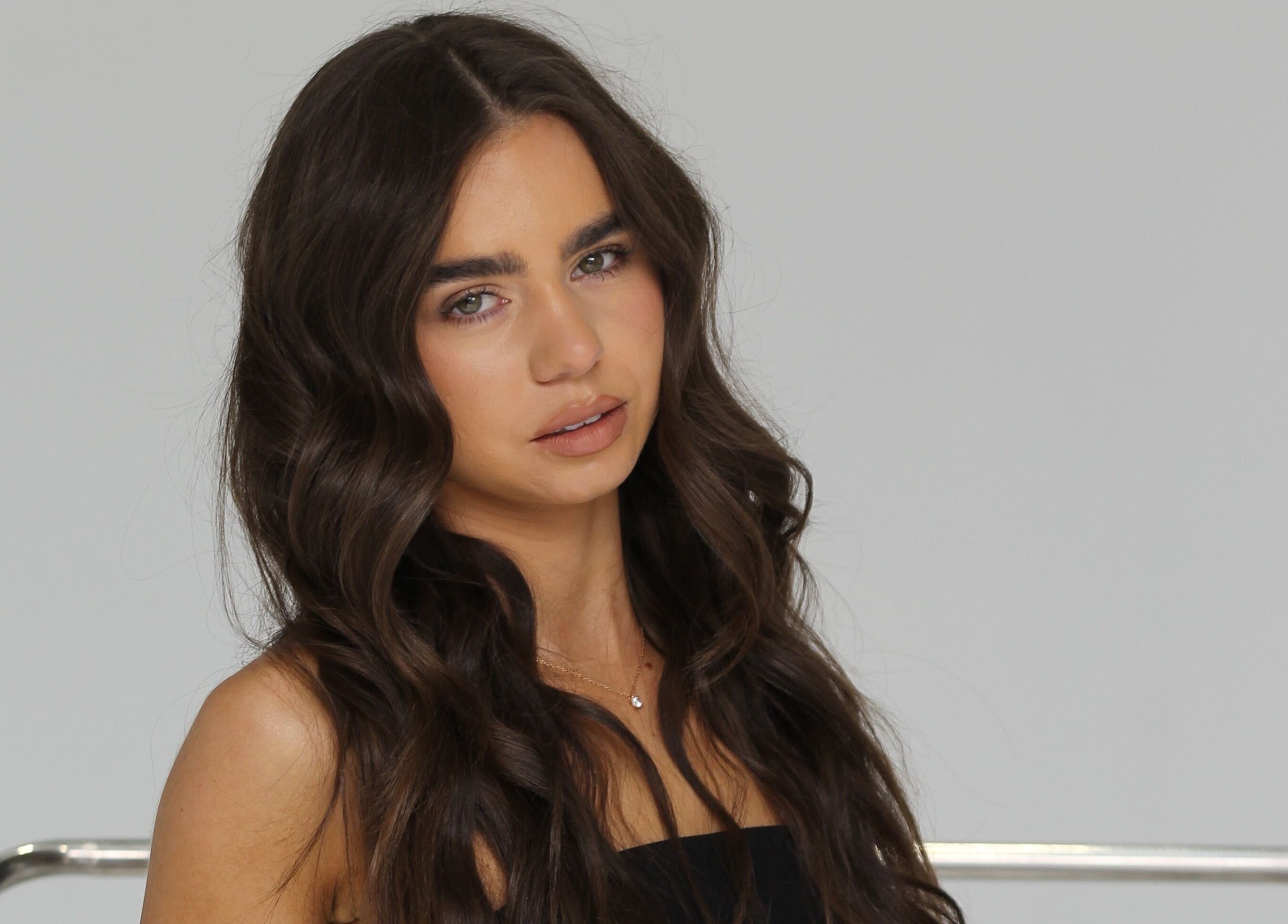 Radiant brunette with wavy hair at Glow Your Way, Two Wells, South Australia, AU.