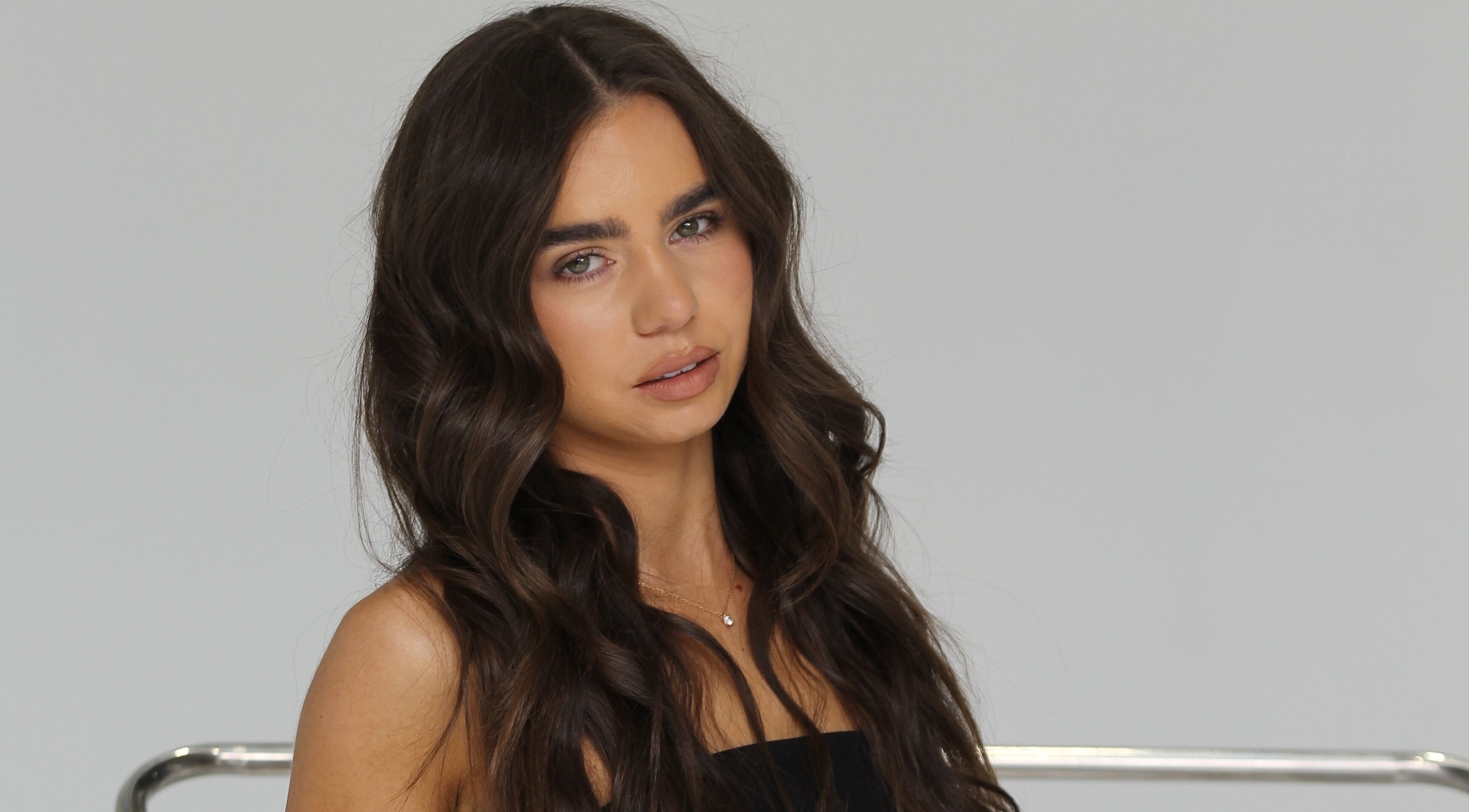 Radiant brunette with wavy hair at Glow Your Way, Two Wells, South Australia, AU.