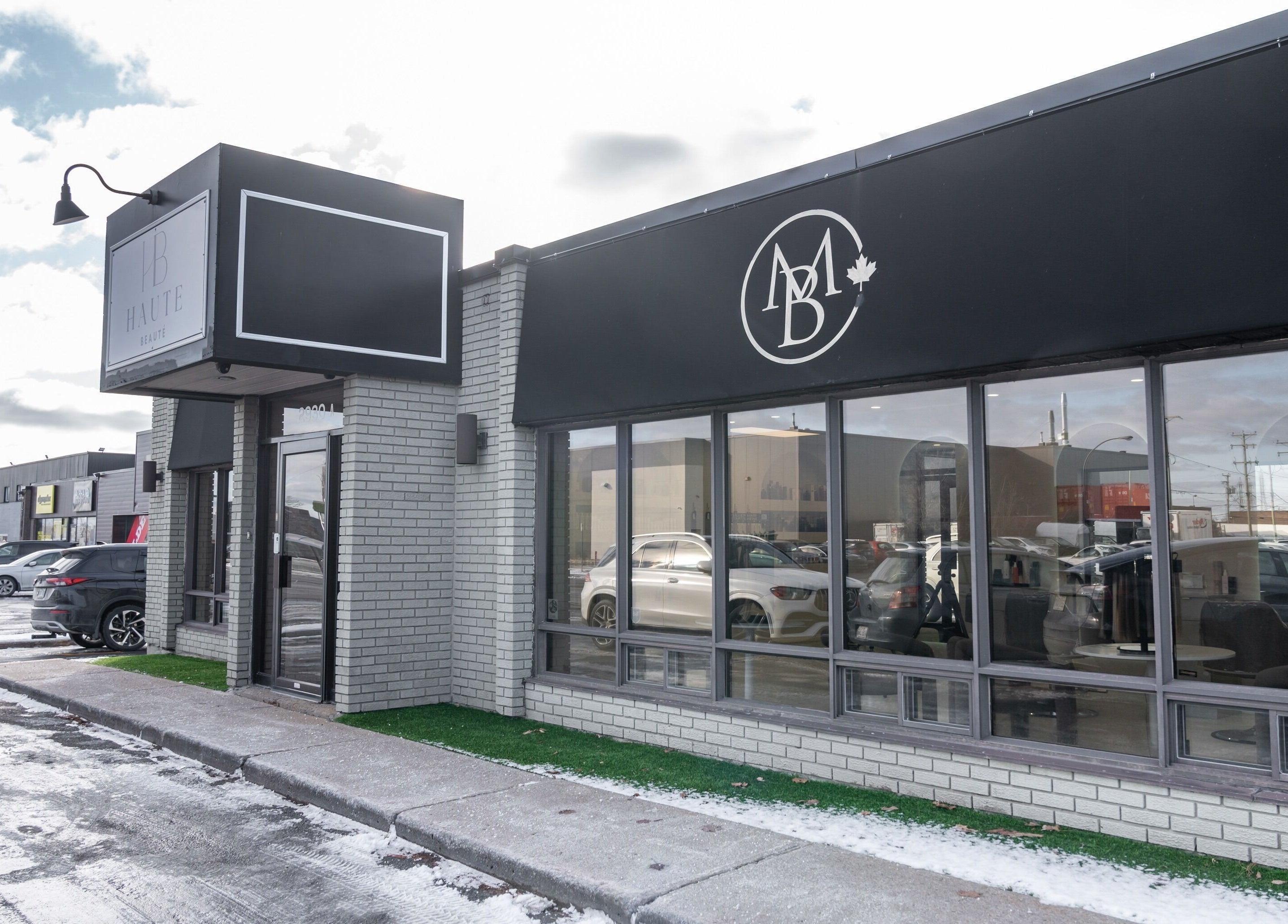 Haute Beauté exterior in Laval, Québec, CA showcasing the modern salon entrance.