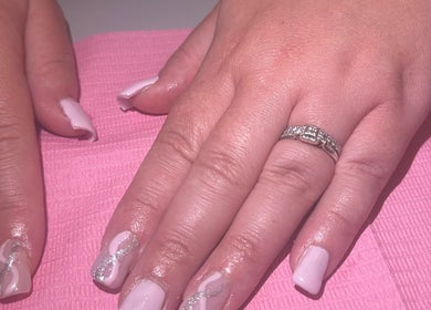 Beautifully manicured nails with pink polish at Bychloebrookesx, Edenbridge, England, GB.