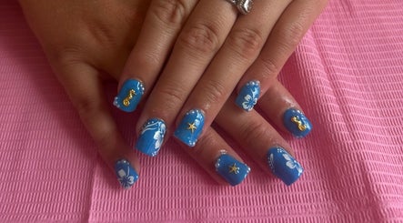 Blue and white sea-themed nail art with gold accents at Bychloebrookesx, Edenbridge, England, GB.